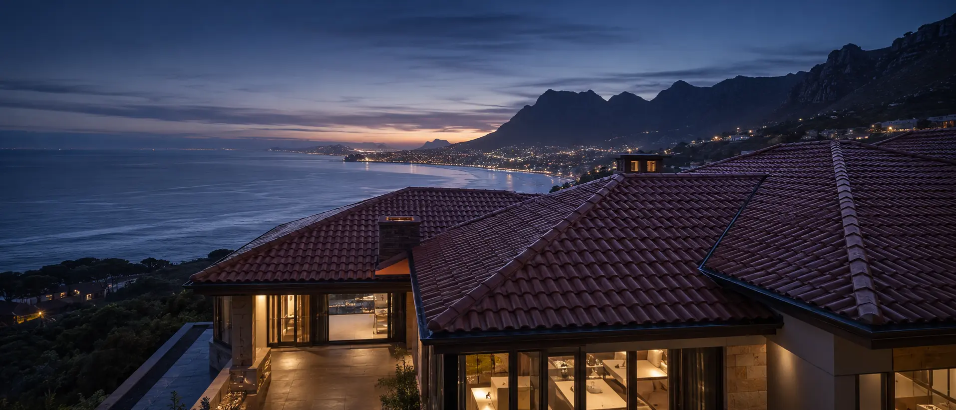 Luxury tiled roof above False Bay at dusk