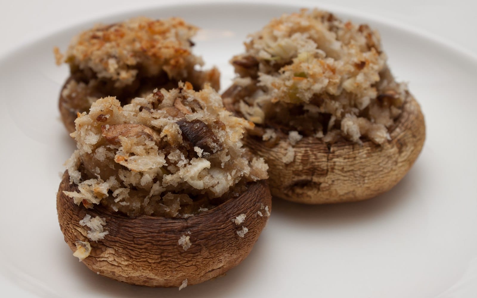 Baked mushroom caps filled with a golden panko and cheese stuffing